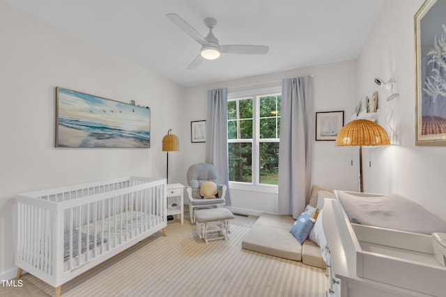 3909 Bristlewood Dr, Durham, NC 27703 - bedroom featuring a crib, carpet floors, and a ceiling fan