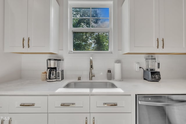 3909 Bristlewood Dr, Durham, NC 27703 - kitchen featuring dishwasher, white cabinets, decorative backsplash, and light countertops