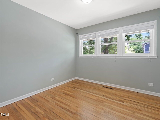 1521 N Duke St, Durham, NC 27701 - spare room featuring baseboards and light wood-style flooring
