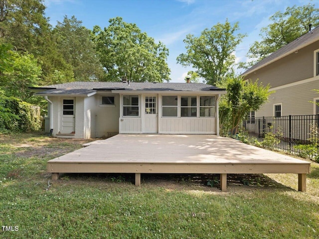 1521 N Duke St, Durham, NC 27701 - back of property with a wooden deck, brick siding, and roof with shingles