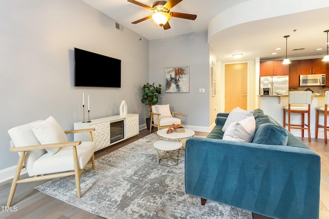618 N Boylan Ave Unit 520, Raleigh, NC 27603 - living room with wood finished floors, a ceiling fan, and recessed lighting