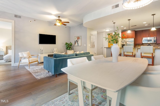 618 N Boylan Ave Unit 520, Raleigh, NC 27603 - living room with wood finished floors, a ceiling fan, and recessed lighting