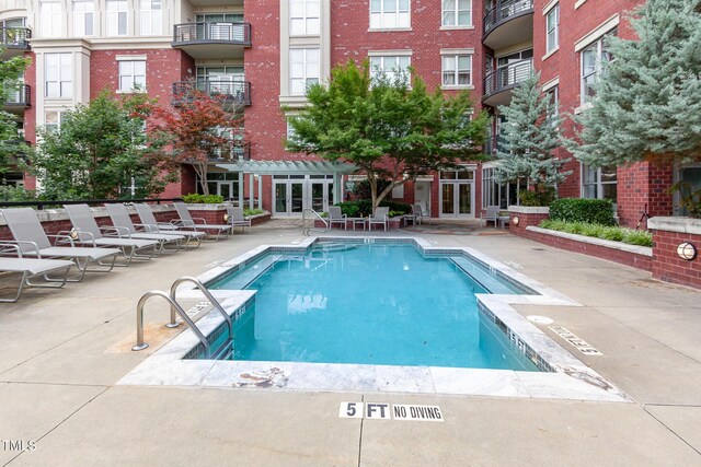 618 N Boylan Ave Unit 520, Raleigh, NC 27603 - community pool featuring french doors, a pergola, and a patio