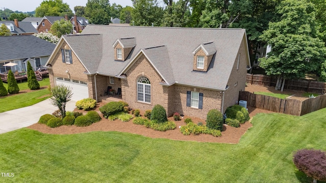 412 Whitt Ave, Burlington, NC 27215 - cape cod home featuring brick siding and concrete driveway