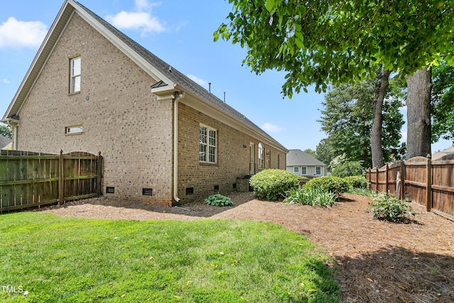 412 Whitt Ave, Burlington, NC 27215 - back of property with crawl space and brick siding