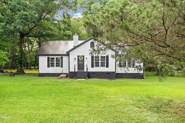 2809 Titleist Dr, Hillsborough, NC 27278 - view of front of house with crawl space, a chimney, a front lawn, a metal roof, and entry steps