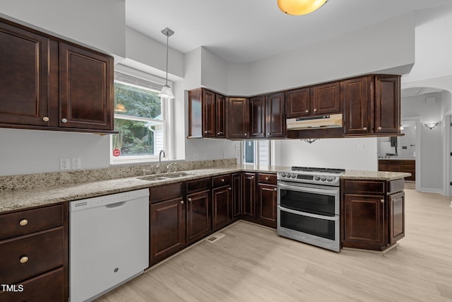 300 Oak Ridge Dr, Hillsborough, NC 27278 - kitchen featuring white dishwasher, range with two ovens, under cabinet range hood, hanging light fixtures, and dark brown cabinets