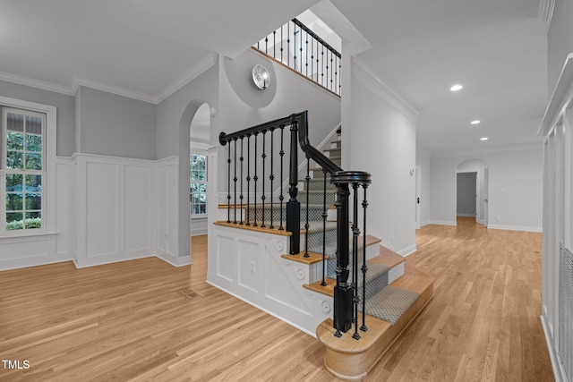 300 Oak Ridge Dr, Hillsborough, NC 27278 - stairs featuring arched walkways, wood finished floors, plenty of natural light, ornamental molding, and a decorative wall