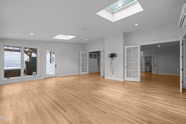 300 Oak Ridge Dr, Hillsborough, NC 27278 - unfurnished living room with a skylight, light wood-type flooring, french doors, recessed lighting, and a wall unit AC