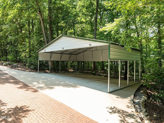 300 Oak Ridge Dr, Hillsborough, NC 27278 - surrounding community with concrete driveway, a wooded view, and a detached carport