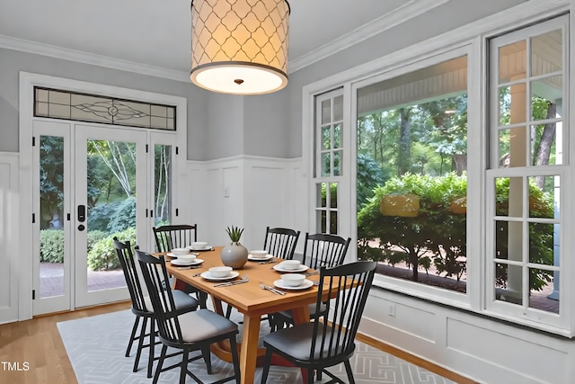 300 Oak Ridge Dr, Hillsborough, NC 27278 - dining space with a decorative wall, healthy amount of natural light, ornamental molding, wainscoting, and wood finished floors