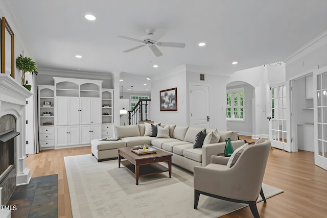 300 Oak Ridge Dr, Hillsborough, NC 27278 - living room featuring ornamental molding, stairs, a fireplace with flush hearth, a ceiling fan, and wood finished floors