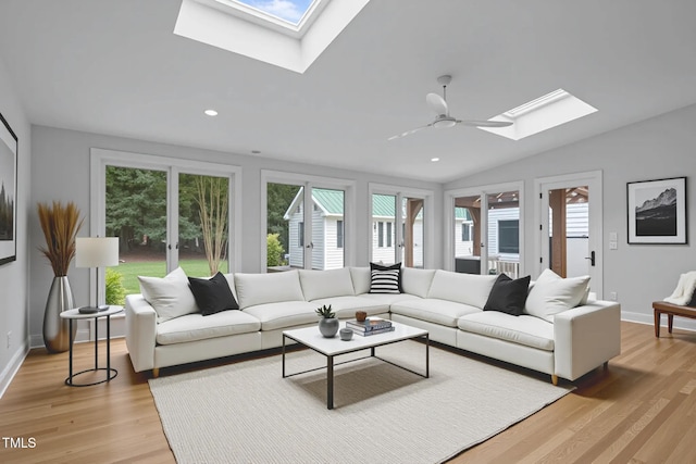 300 Oak Ridge Dr, Hillsborough, NC 27278 - living room with a skylight, healthy amount of natural light, light wood-style flooring, vaulted ceiling, and recessed lighting