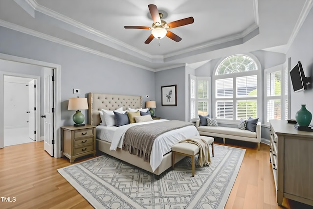 300 Oak Ridge Dr, Hillsborough, NC 27278 - bedroom featuring a tray ceiling, light wood-type flooring, crown molding, and a ceiling fan