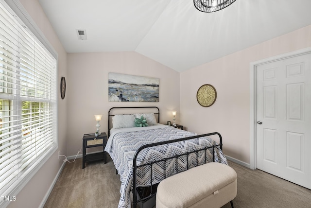 1625 Main Divide Dr, Wake Forest, NC 27587 - carpeted bedroom featuring vaulted ceiling and baseboards