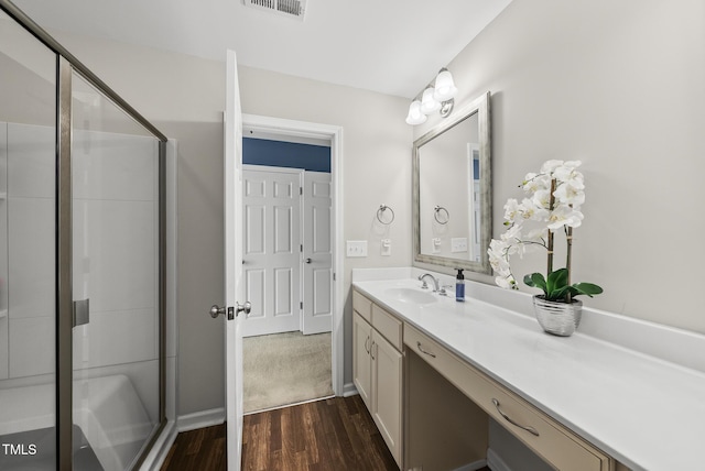 1625 Main Divide Dr, Wake Forest, NC 27587 - bathroom featuring wood finished floors, vanity, and a stall shower