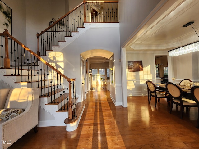 502 Willowmere Ct, Cary, NC 27513 - foyer with hardwood / wood-style flooring, arched walkways, stairs, and ornamental molding