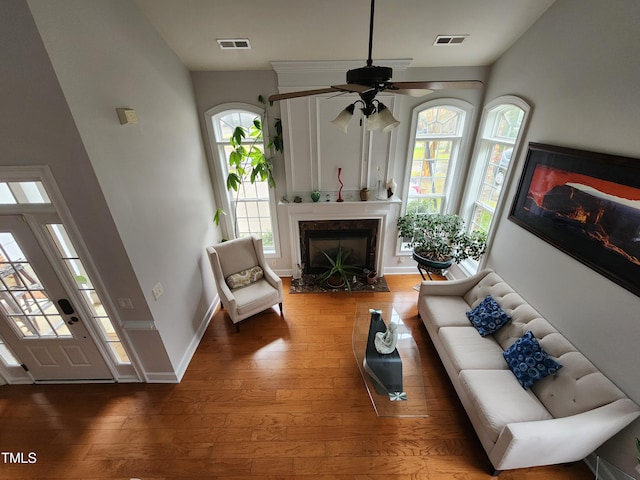502 Willowmere Ct, Cary, NC 27513 - living room with a fireplace, wood-type flooring, and a ceiling fan