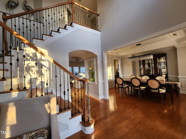 502 Willowmere Ct, Cary, NC 27513 - foyer entrance featuring crown molding, wood-type flooring, stairway, arched walkways, and a ceiling fan