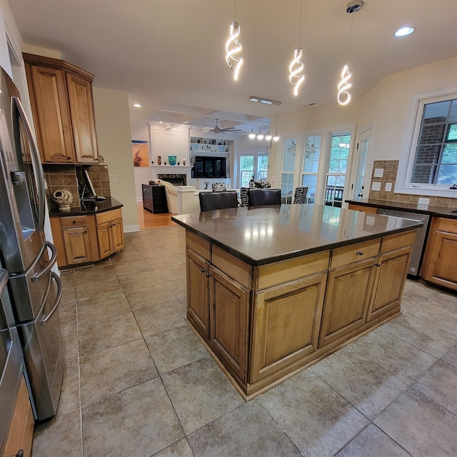 502 Willowmere Ct, Cary, NC 27513 - kitchen featuring stainless steel appliances, tasteful backsplash, open floor plan, brown cabinets, and recessed lighting