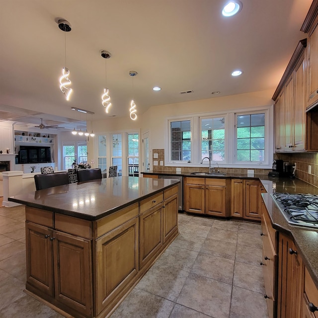502 Willowmere Ct, Cary, NC 27513 - kitchen featuring appliances with stainless steel finishes, decorative backsplash, open floor plan, brown cabinets, and recessed lighting