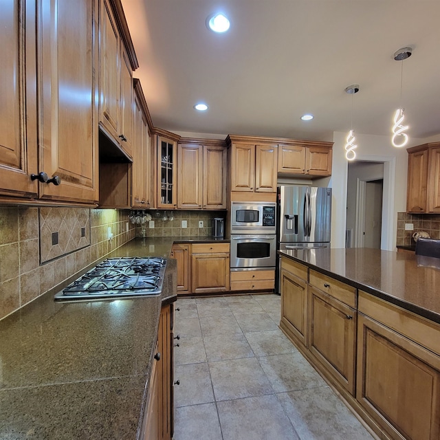 502 Willowmere Ct, Cary, NC 27513 - kitchen featuring stainless steel appliances, tasteful backsplash, brown cabinets, glass insert cabinets, and recessed lighting