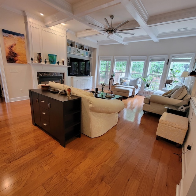 502 Willowmere Ct, Cary, NC 27513 - living area with a ceiling fan, coffered ceiling, light wood-style floors, beam ceiling, and a fireplace