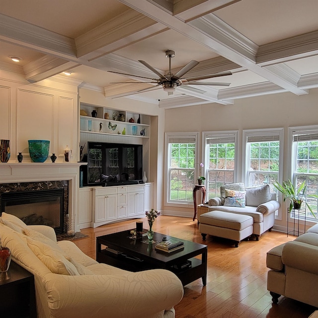 502 Willowmere Ct, Cary, NC 27513 - living room featuring ceiling fan, coffered ceiling, crown molding, light wood-style floors, and beamed ceiling