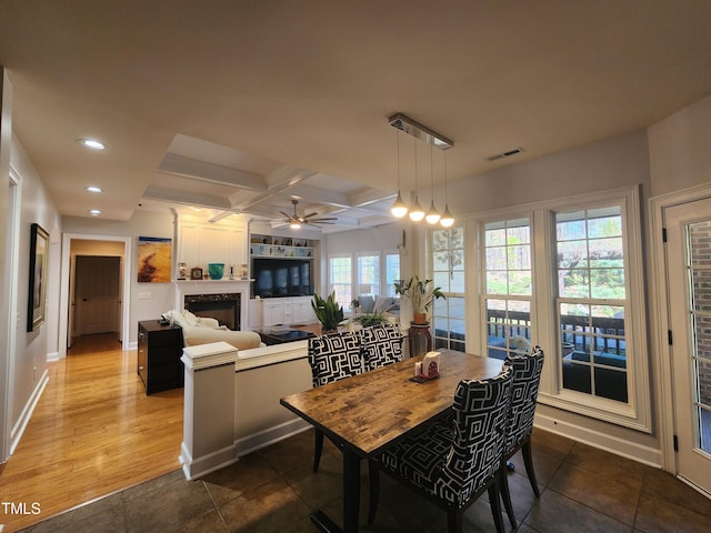 502 Willowmere Ct, Cary, NC 27513 - dining room featuring ceiling fan, recessed lighting, a fireplace, coffered ceiling, and beam ceiling
