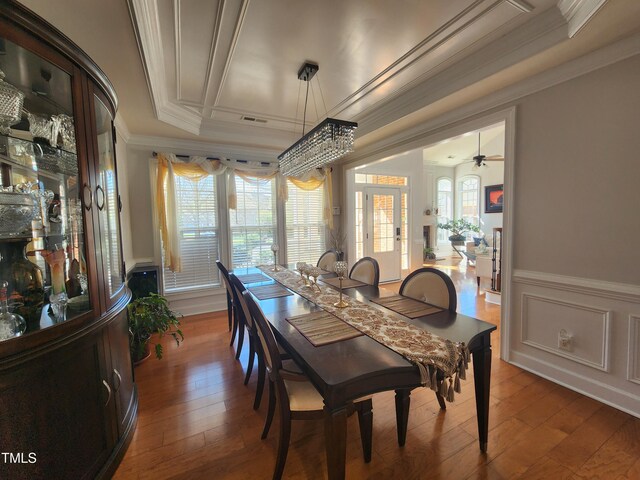 502 Willowmere Ct, Cary, NC 27513 - dining area with ornamental molding, hardwood / wood-style flooring, wainscoting, and a decorative wall