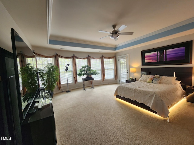 502 Willowmere Ct, Cary, NC 27513 - bedroom with a raised ceiling, light colored carpet, ornamental molding, and a ceiling fan