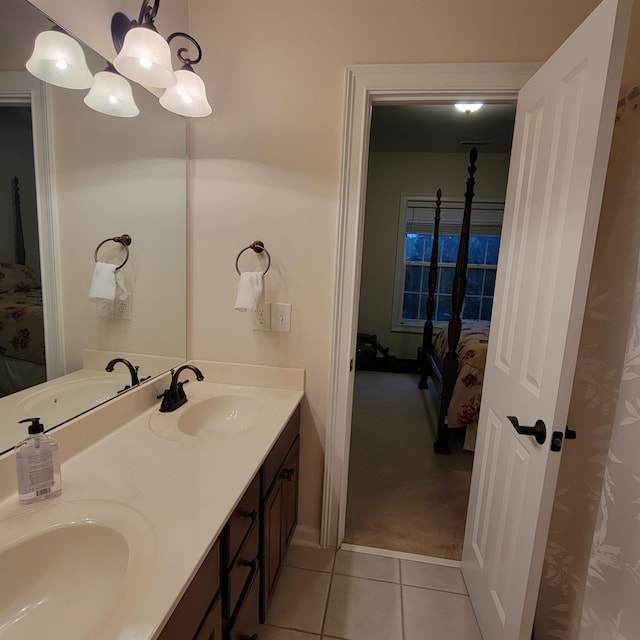 502 Willowmere Ct, Cary, NC 27513 - ensuite bathroom with tile patterned flooring, double vanity, and a chandelier