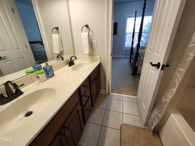 502 Willowmere Ct, Cary, NC 27513 - ensuite bathroom with double vanity and tile patterned flooring