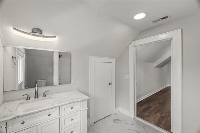 2617 Fayetteville St, Durham, NC 27707 - full bathroom featuring vanity, vaulted ceiling, and marble finish flooring