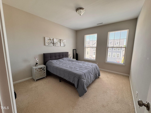 1005 Lathrop Ln, Apex, NC 27523 - bedroom featuring light colored carpet and baseboards