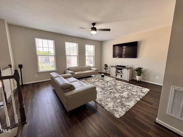 1005 Lathrop Ln, Apex, NC 27523 - living room featuring a ceiling fan and dark wood-type flooring