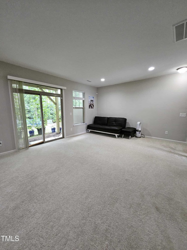 1005 Lathrop Ln, Apex, NC 27523 - carpeted living room featuring recessed lighting