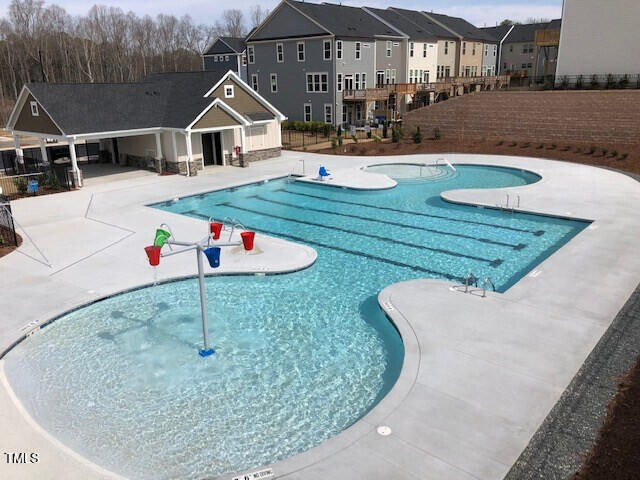 1005 Lathrop Ln, Apex, NC 27523 - community pool with a patio area and a residential view