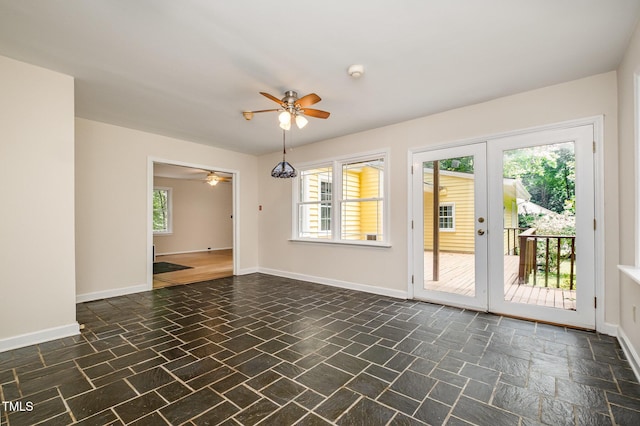 420 Lipscomb Grove Church Rd, Hillsborough, NC 27278 - unfurnished room featuring a ceiling fan, french doors, dark stone finish floors, and a smoke detector