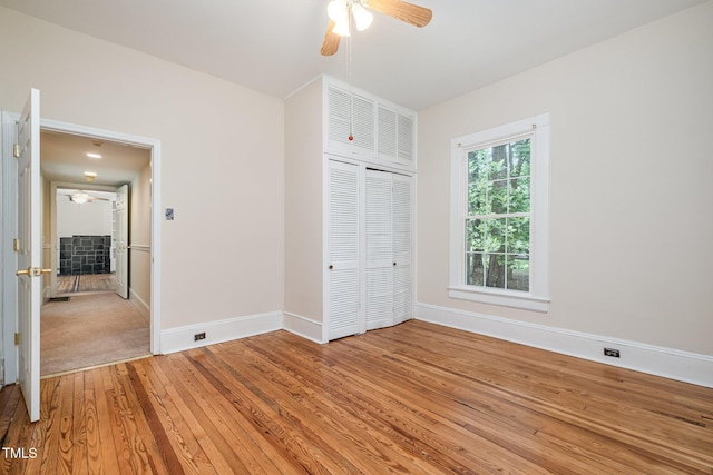 420 Lipscomb Grove Church Rd, Hillsborough, NC 27278 - unfurnished bedroom featuring light wood-style flooring, a closet, and a ceiling fan