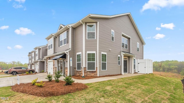 1911 Hinesley Dr, Durham, NC 27703 - view of property exterior featuring an attached garage and driveway