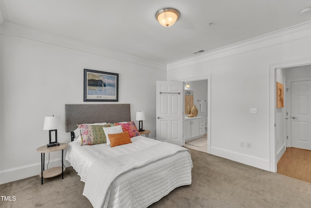 1310 Durlain Dr Unit 103, Raleigh, NC 27614 - carpeted bedroom with ornamental molding and ensuite bathroom