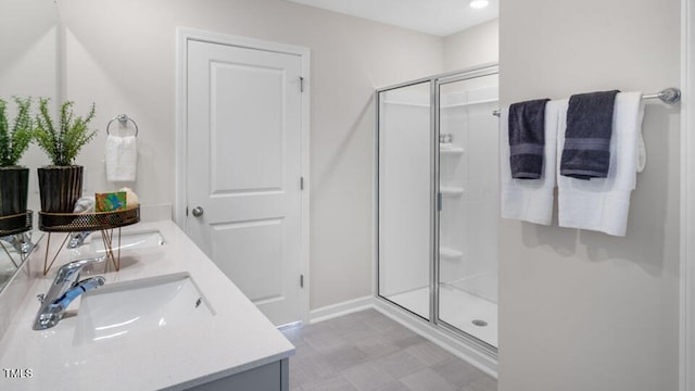 704 Holstein Dairy Way, Wake Forest, NC 27587 - bathroom featuring double vanity, a stall shower, and tile patterned floors