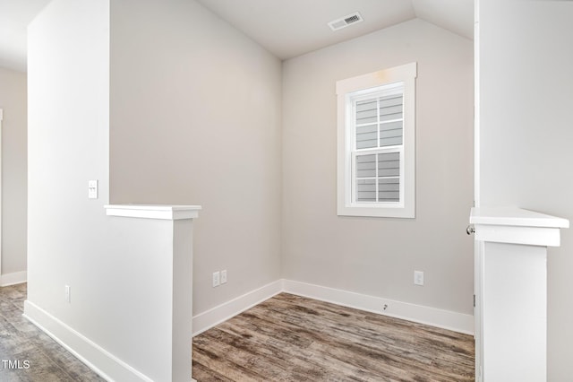 442 Granite Mill Blvd, Chapel Hill, NC 27516 - spare room with wood finished floors and vaulted ceiling