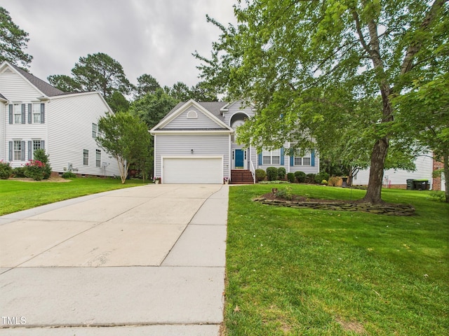 7501 Montibillo Pkwy, Durham, NC 27713 - view of front of home with a garage, concrete driveway, and a front lawn
