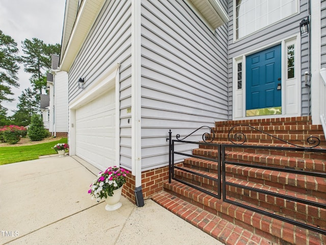 7501 Montibillo Pkwy, Durham, NC 27713 - property entrance with a garage and driveway