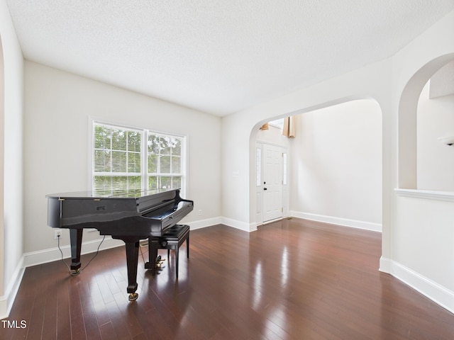7501 Montibillo Pkwy, Durham, NC 27713 - entrance foyer with arched walkways and wood finished floors