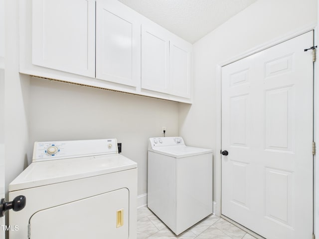 7501 Montibillo Pkwy, Durham, NC 27713 - washroom with washer and clothes dryer, light marble finish floors, cabinet space, and a textured ceiling