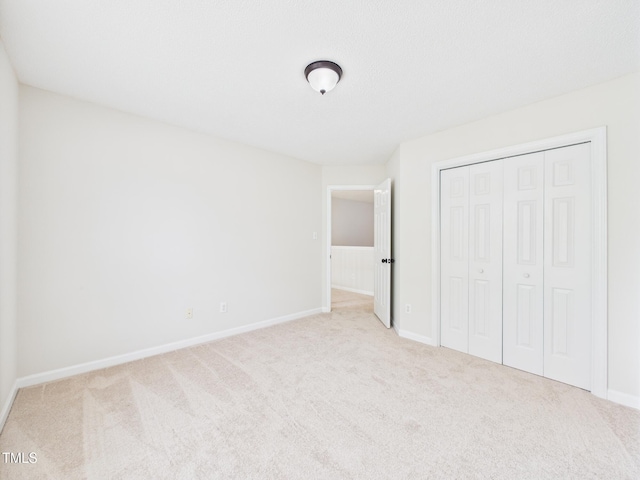 7501 Montibillo Pkwy, Durham, NC 27713 - unfurnished bedroom with carpet floors and a closet