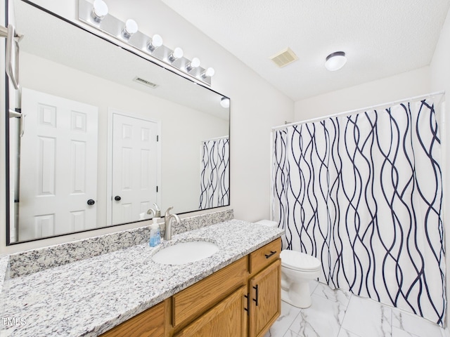 7501 Montibillo Pkwy, Durham, NC 27713 - full bath featuring vanity, marble look tiles, a shower with shower curtain, and a textured ceiling